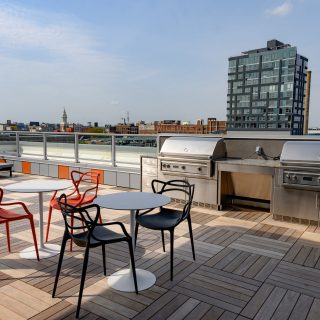 The National rooftop with comfortable seating and two professional BBQ grills in Old City apartment homes for rent